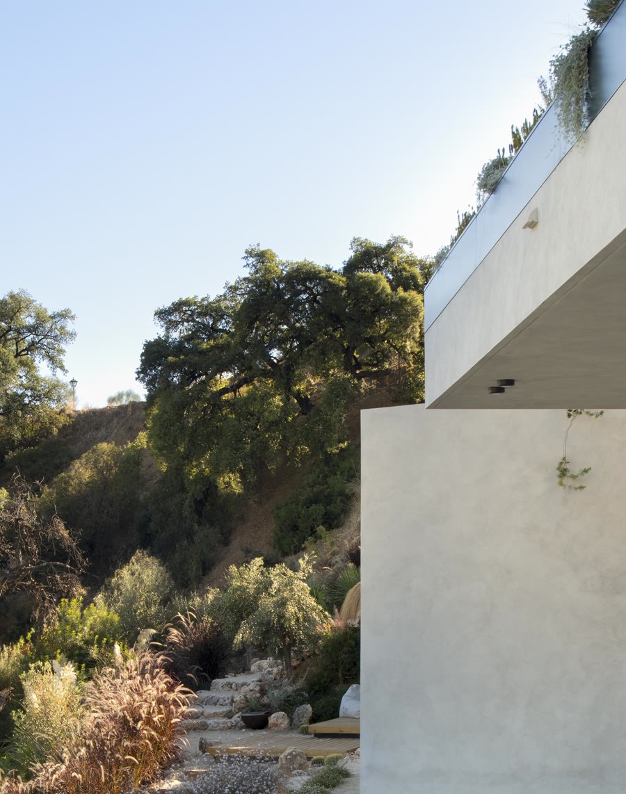 Raw concrete cantilever against the sky