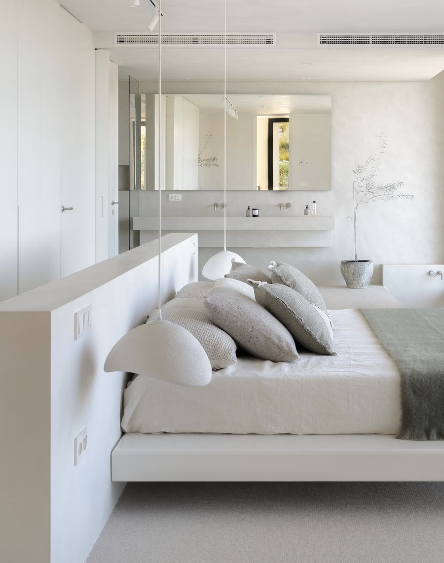 Linen bed into the open bathroom